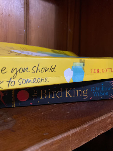 Two books on a bookshelf.