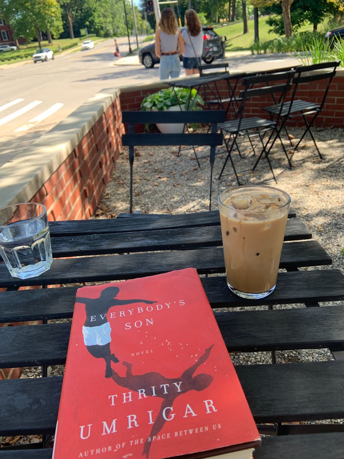 coffee and book on outdoor patio