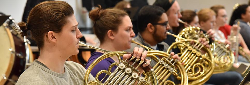 Students playing French horns