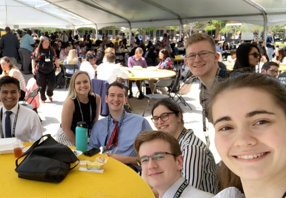 A student taking a selfie at a conference